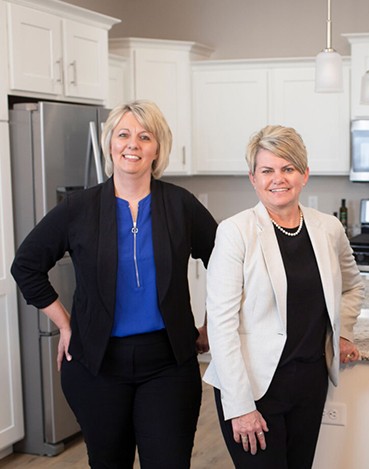 Bank lender sitting at desk with customer